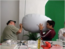 father and son robotics building team